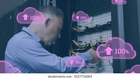 Image of clouds with increasing numbers over caucasian man working in server room. cloud computing, data uploading, computers and technology concept digitally generated image. - Powered by Shutterstock