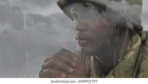 Image of clouds and rain over sad african american male soldier. mental health awareness week and celebration concept digitally generated image. - Powered by Shutterstock