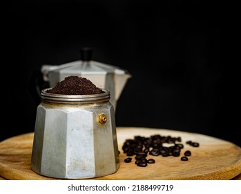 An Image Coffee Ground In Moka Pot Is A Coffee Maker Is A Beverage For Break Morning On The Dark Background.