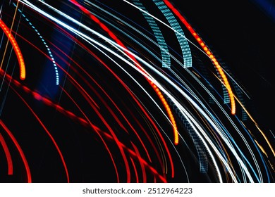 The image is a colorful, abstract representation of a car's headlights. The bright colors and lines create a sense of movement and energy, as if the car is speeding down a dark road - Powered by Shutterstock