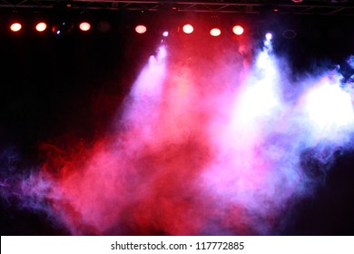 Image of colorful concert lighting against a dark background