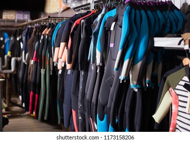 Image Of Colorful Wetsuit Hanging In The Modern Store For Surfing