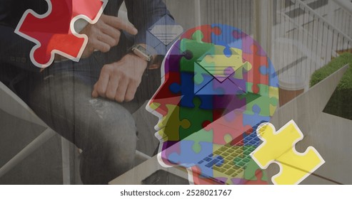 Image of colourful puzzle over caucasian businessman. Autism awareness month and celebration concept digitally generated image. - Powered by Shutterstock