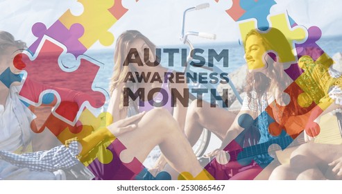 Image of colourful puzzle pieces and autism text over happy friends at summer beach party. autism, learning difficulties, support and awareness concept digitally generated image. - Powered by Shutterstock