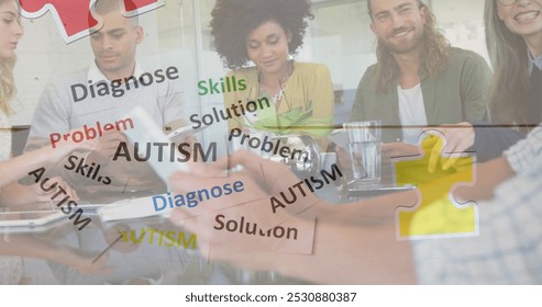 Image of colourful puzzle pieces and autism text over business colleagues using tablet. autism, learning difficulties, support and awareness concept digitally generated image. - Powered by Shutterstock