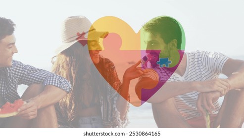 Image of colourful puzzle pieces heart over happy friends at summer beach party. autism, learning difficulties, support and awareness concept digitally generated image. - Powered by Shutterstock