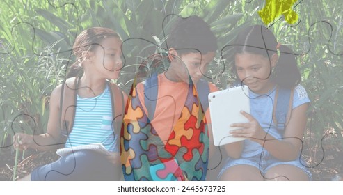 Image of colourful puzzle pieces over kids friends using electronic devices. autism, learning difficulties, support and awareness concept digitally generated image. - Powered by Shutterstock