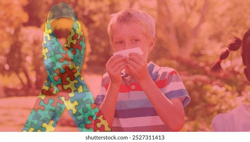 Image of colourful puzzle pieces ribbon over children blowing their noses. autism, learning difficulties, support and awareness concept digitally generated image. - Powered by Shutterstock