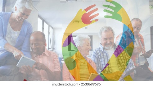 Image of colourful puzzle pieces ribbon over senior friends using tablets. autism, learning difficulties, support and awareness concept digitally generated image. - Powered by Shutterstock