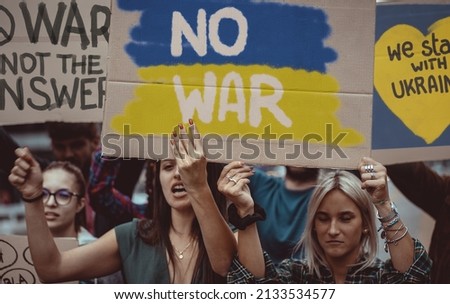 Image composition to illustrate pacifists young people protesting against the war aggression against Ukraine in 2022 from Russia.