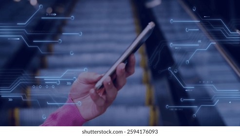 Image of computer circuit board over hand holding smartphone. Global communication, technology, computing and digital interface concept digitally generated image.