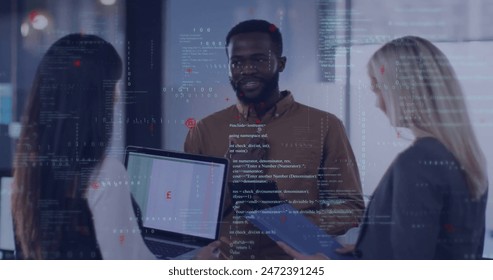 Image of computer language over diverse coworkers standing and sharing ideas in office. Digital composite, multiple exposure, planning, teamwork, discussion, coding and technology concept.