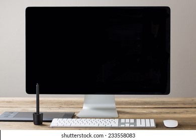 Image Of A Computer Screen With A Lamp And Drawing Tablet, With Sticky Notes