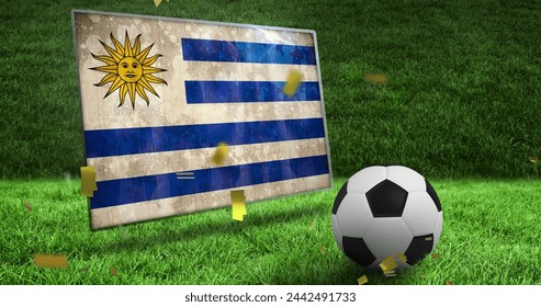 Image of confetti and flag of uruguay over football and stadium. Global sport, patriotism and digital interface concept digitally generated image.