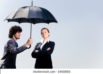 Image Of Confident Business Man Holding Umbrella And Looking At Woman On The Background Of Sky