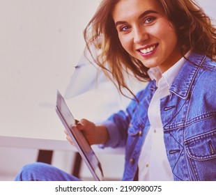 Image Of A Confident Young Woman Sitting At Working Desk