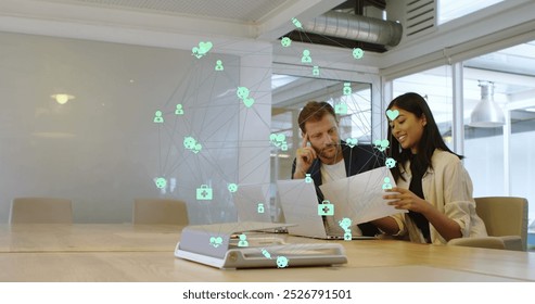 Image of connected computer icons forming globe over multiracial coworkers discussing in office. Digital composite, multiple exposure, global network, business, teamwork, meeting and technology. - Powered by Shutterstock