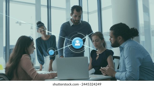 Image of connected profile icons over diverse coworkers sharing ideas in meeting at office. Digital composite, multiple exposure, communication, planning, teamwork and technology concept. - Powered by Shutterstock