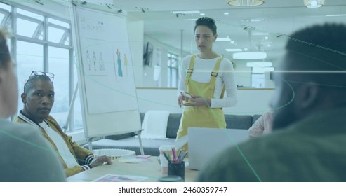 Image of connections and data processing over business people in office. Global computing, finance, business and data processing concept digitally generated image.