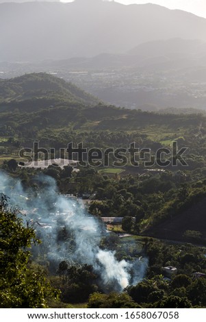 image of a controlled brush fire in the caribbean mountain town of Ocoa, dominican republic.