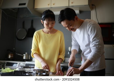 Image Of A Couple Making Dumplings 
