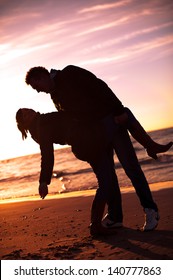 An image of couple on the beach