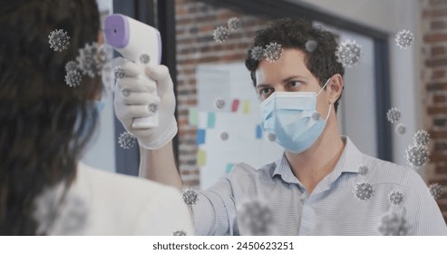 Image of covid 19 cells over man in face mask measuring woman's temperature. Healthcare and protection during coronavirus covid 19 pandemic, digitally generated image. - Powered by Shutterstock