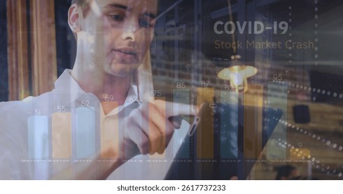 Image of covid 19 data processing and statistics over caucasian man using laptop. global covid 19 pandemic, business, finance and data processing concept digitally generated image.