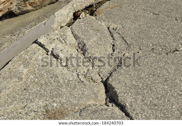 An image\
of cracked pathway from Japan earthquake\
