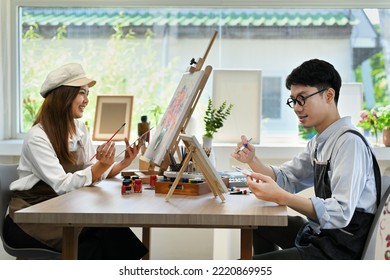 Image Of Creative Young Couple Painting Picture In Art Studio Lit By Sunlight. Leisure Activity, Creative Hobby And Art Concept