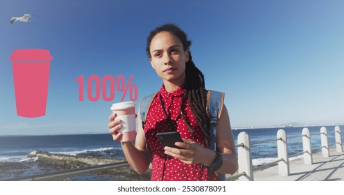 Image of cup of coffee with percentage icon over biracial woman with coffee walking on promenade. health and fitness concept digitally generated image. - Powered by Shutterstock