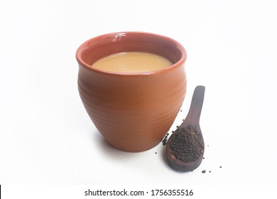 Image of a cup of a tea, Chai - Indian Chai (Chai in kulhad) Pouring in Earthen cups (Clay cup) known as Kulhad. Masala Tea is Popularly known in India as Masala Chai.