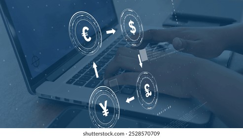 Image of currency icons with data processing over african american businesswoman using laptop. Finances, business, communication, computing and digital interface concept digitally generated image.