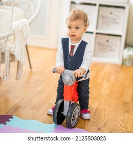 Image of cute little baby boy riding his first bike. - Powered by Shutterstock