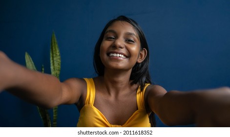 Image Of A Cute Young Brunette Teenage Girl  Reaching Hands Forward Catching Something | Smiling Girl With Friendly Expression Trying To Greet Someone With A Warm Hug