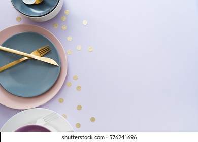 image of cutlery sets and plates. party theme