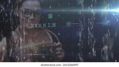Image of cyber attack warning and data processing over female photographer. global online security, technology, data processing and digital interface concept digitally generated image.