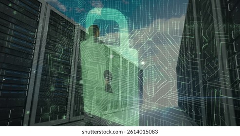 Image of cyber attack warning and padlock over biracial man in server room. global internet security and data processing concept digitally generated image.