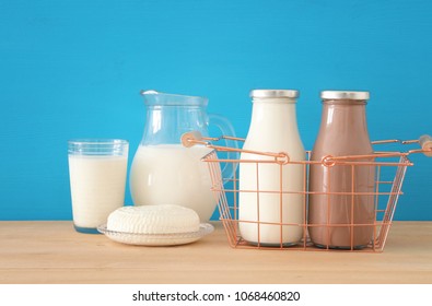 image of dairy products over wooden background. Symbols of jewish holiday - Shavuot