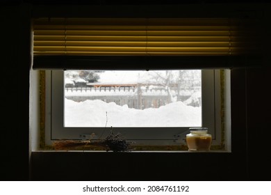 An Image Of A Dark And Moody Basement Window With Dirty Old Window Blinds. 