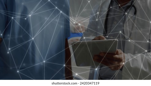 Image of data and network of connections over caucasian male doctor using tablet. Global medicine, networks, digital interface, computing and data processing concept digitally generated image. - Powered by Shutterstock