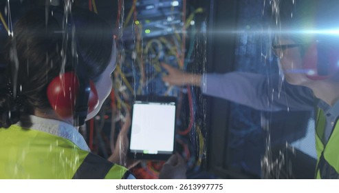 Image of data over diverse male and female it engineers checking computer server. digital interface, cloud computing concept and technology concept digitally generated image. - Powered by Shutterstock - Get 15% off with code: PIKWIZARD15