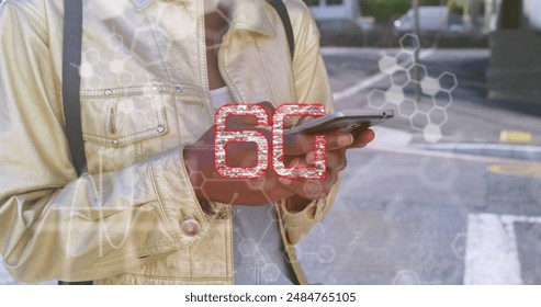 Image of data processing and 6g text over african american woman using smartphone. Global business, national flags and digital interface concept digitally generated image. - Powered by Shutterstock