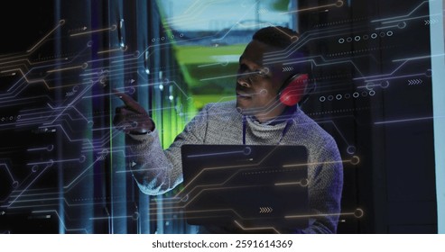 Image of data processing and african american male it technician with laptop by computer servers. Global connections, computing and data processing concept digitally generated image.
