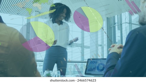 Image of data processing against african american woman discussing with colleagues at office. Computer interface and business data technology concept