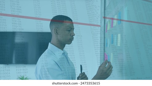 Image of data processing against african american man sticking memo notes at office. Computer interface and business technology concept - Powered by Shutterstock - Get 15% off with code: PIKWIZARD15