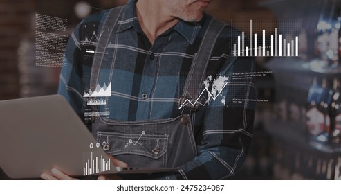 Image of data processing against caucasian male worker using laptop at warehouse. Global networking and logistics business technology concept