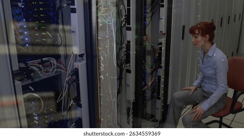 Image of data processing against caucasian female engineer working at server room. Business data storage technology concept