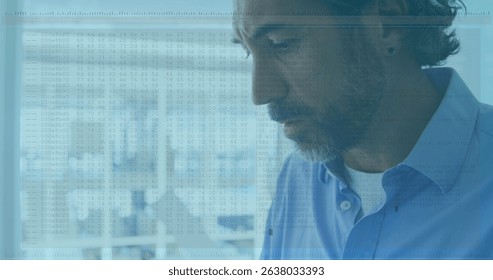 Image of data processing against close up of caucasian senior man using laptop at office. Computer interface and business technology concept