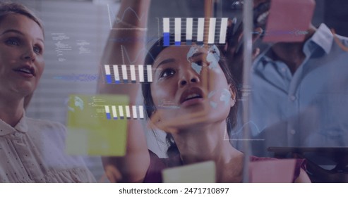 Image of data processing against diverse colleagues discussing over memo notes at office. Computer interface and business technology concept